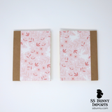 Pink hopping bunny with flowers blank journal