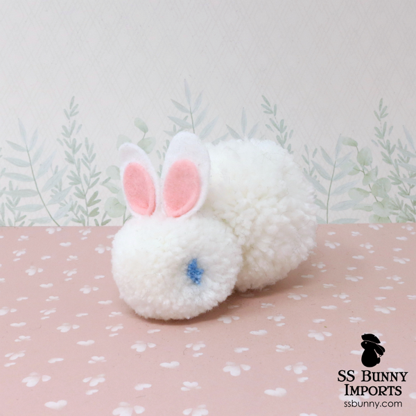 Blue-eyed white pom pom bunny